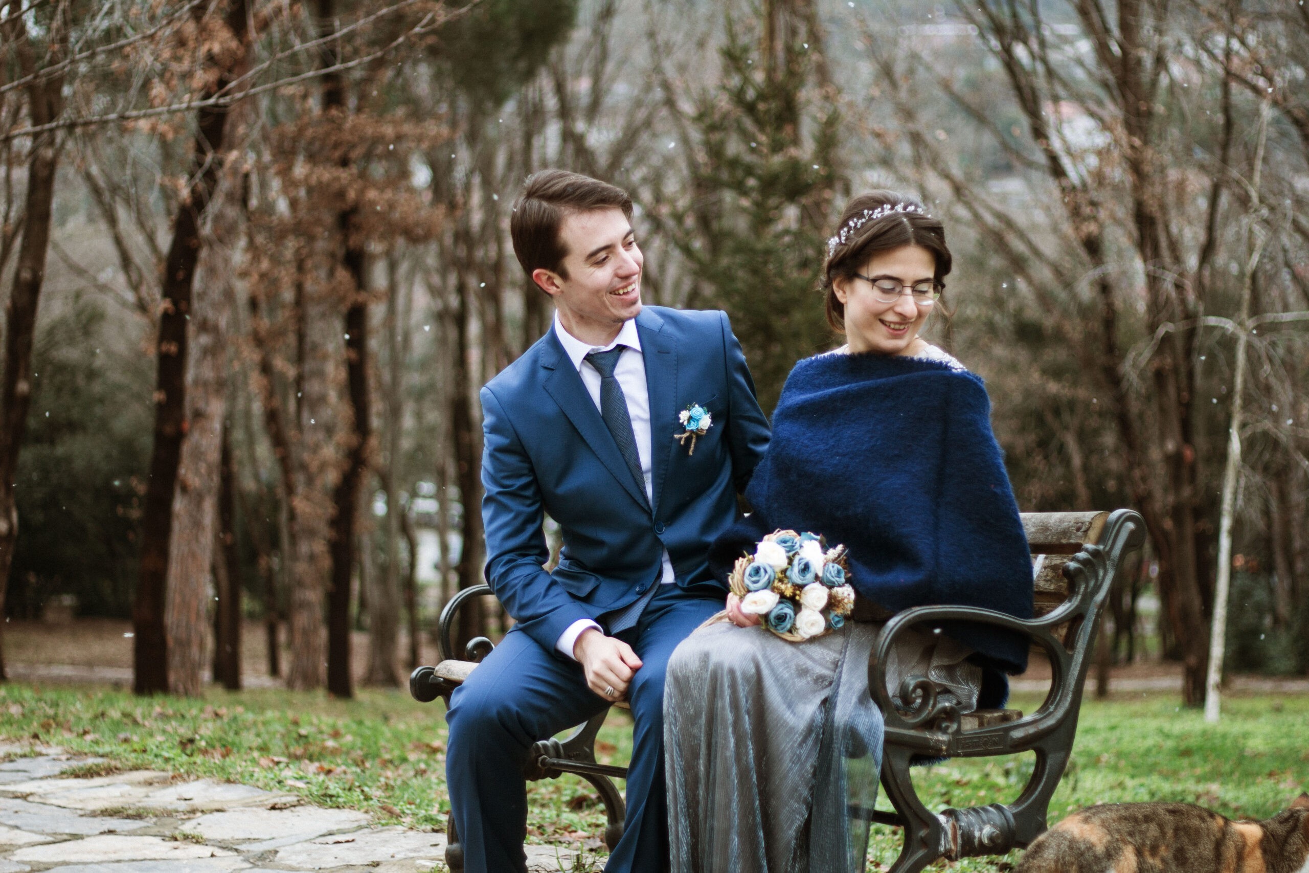 Couple sitting on a bench in an autumn park